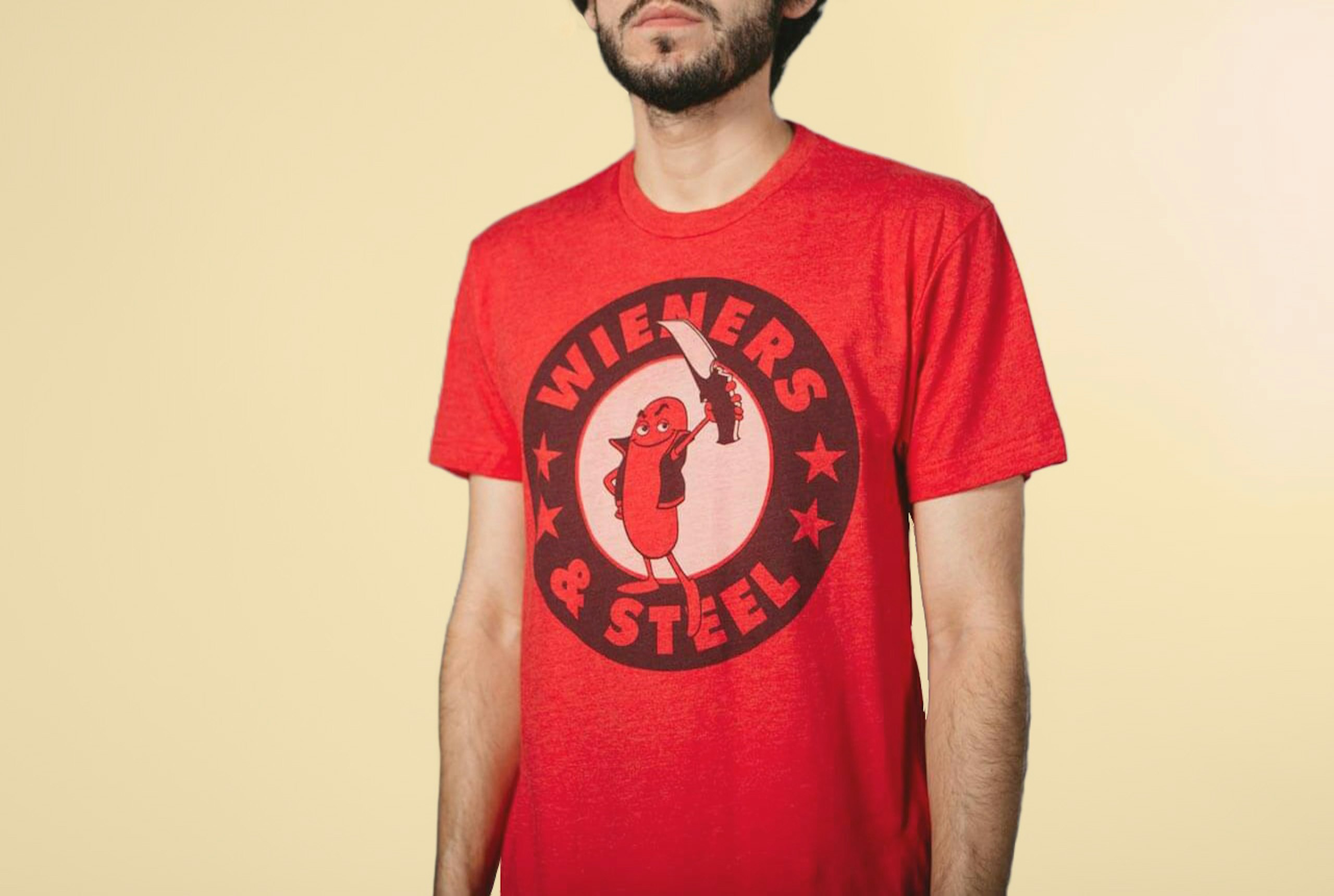 Man wearing red t-shirt with tonal dark and tonal light printing
