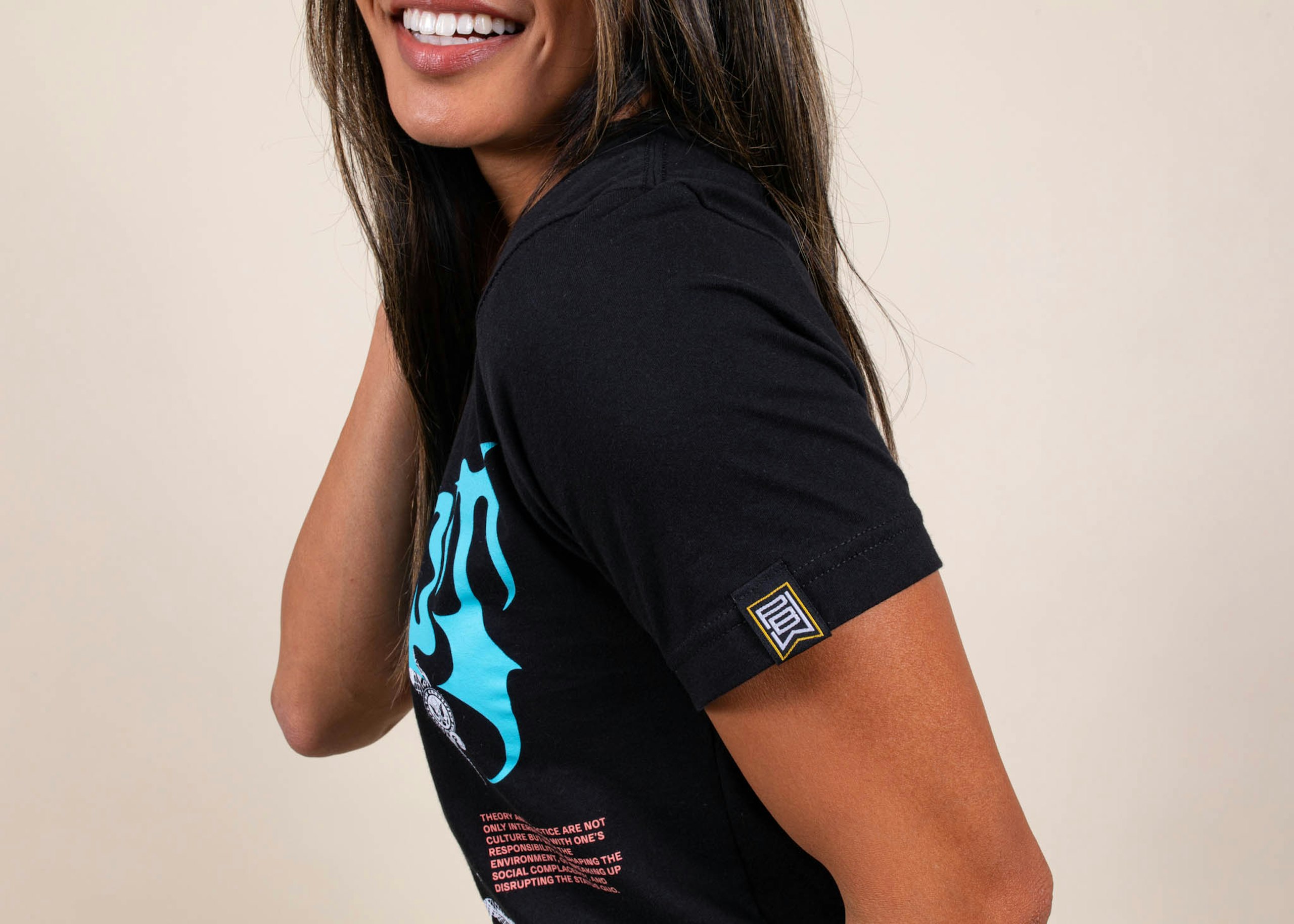 A woman wears a custom hem tag on a sleeve