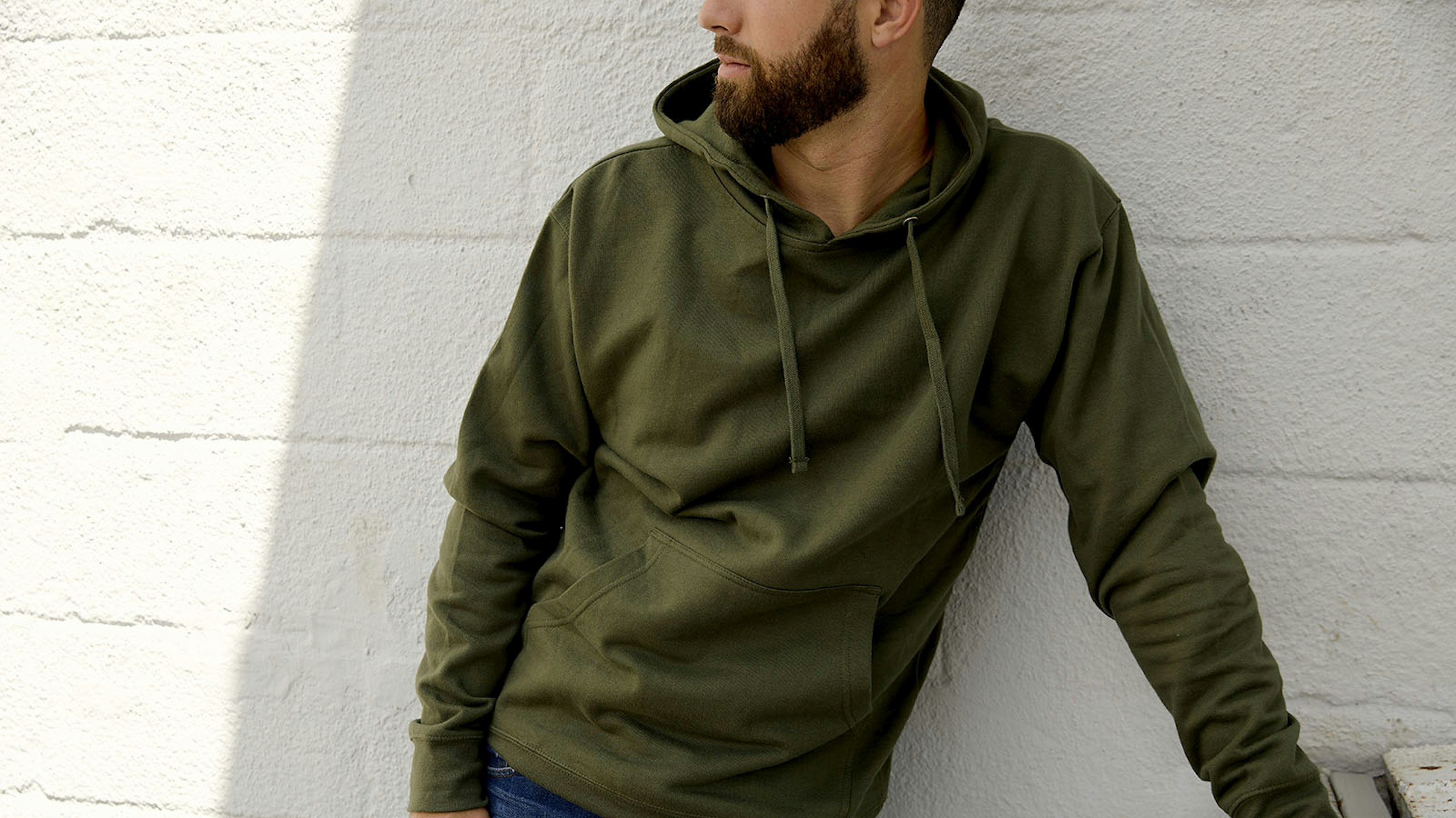 guy wearing a olive green hoodie