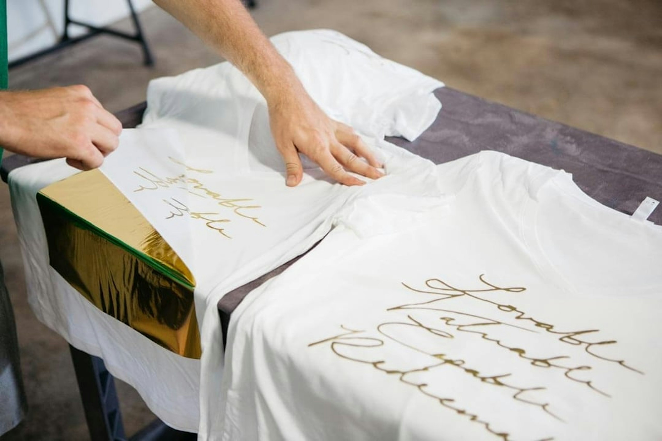 A gold foil design is revealed