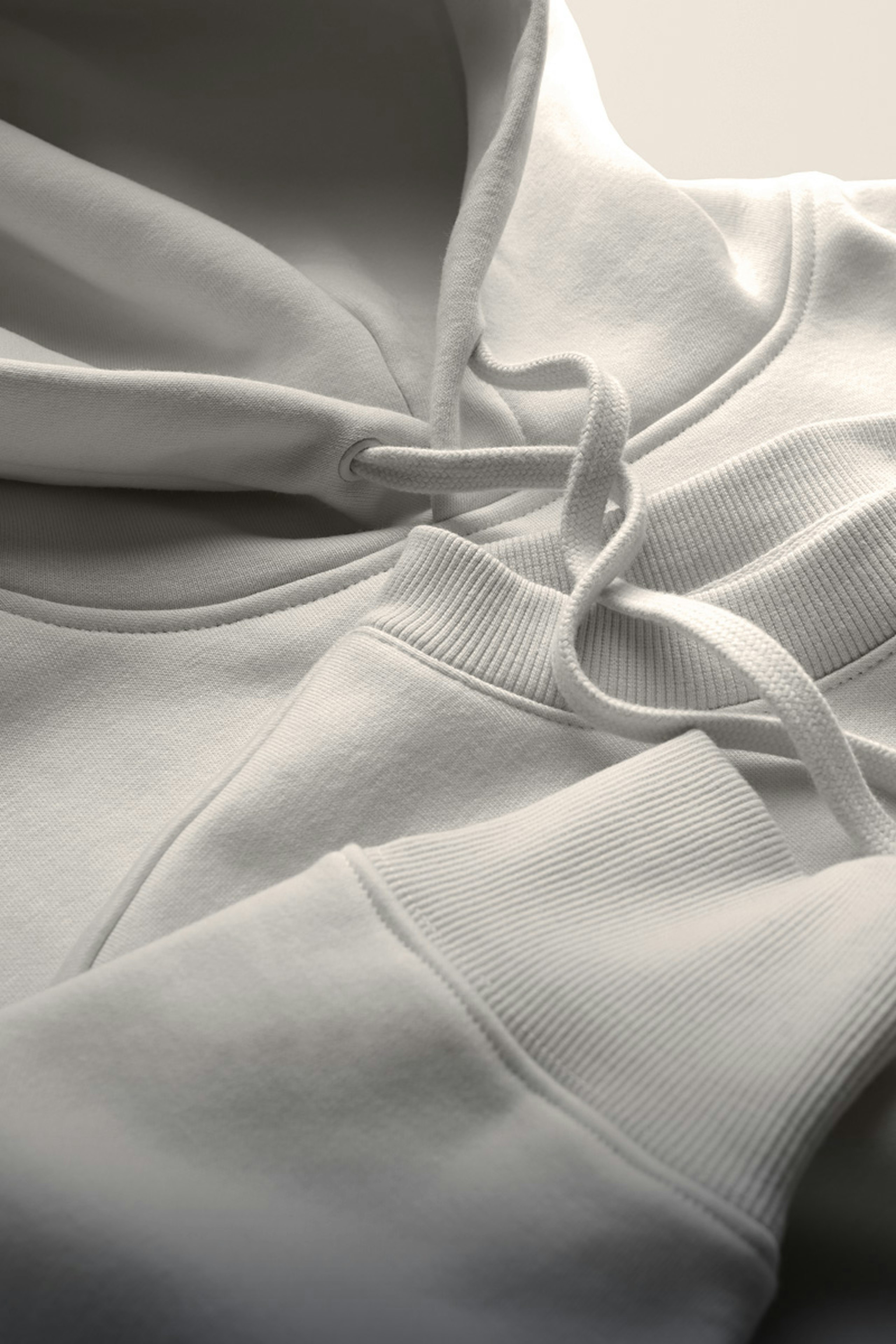 Hoodies and Crewneck sweatshirts laying flat on top of each other