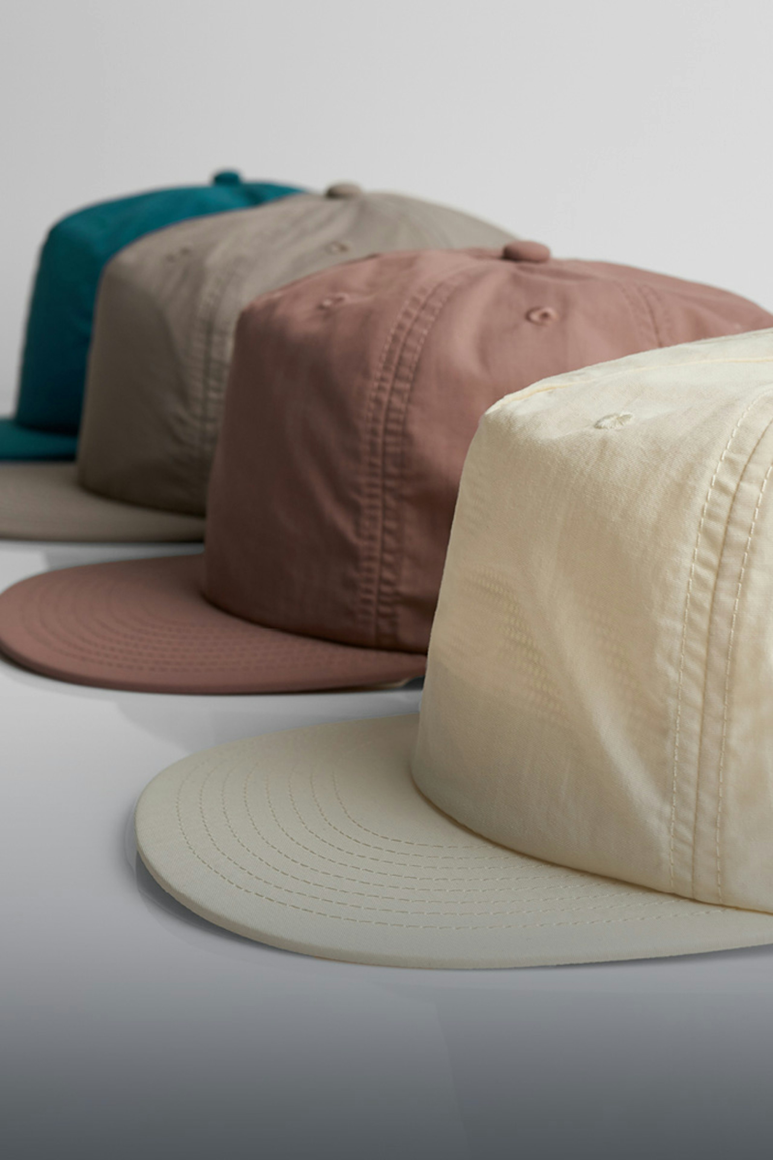 four hats in a row at an angle