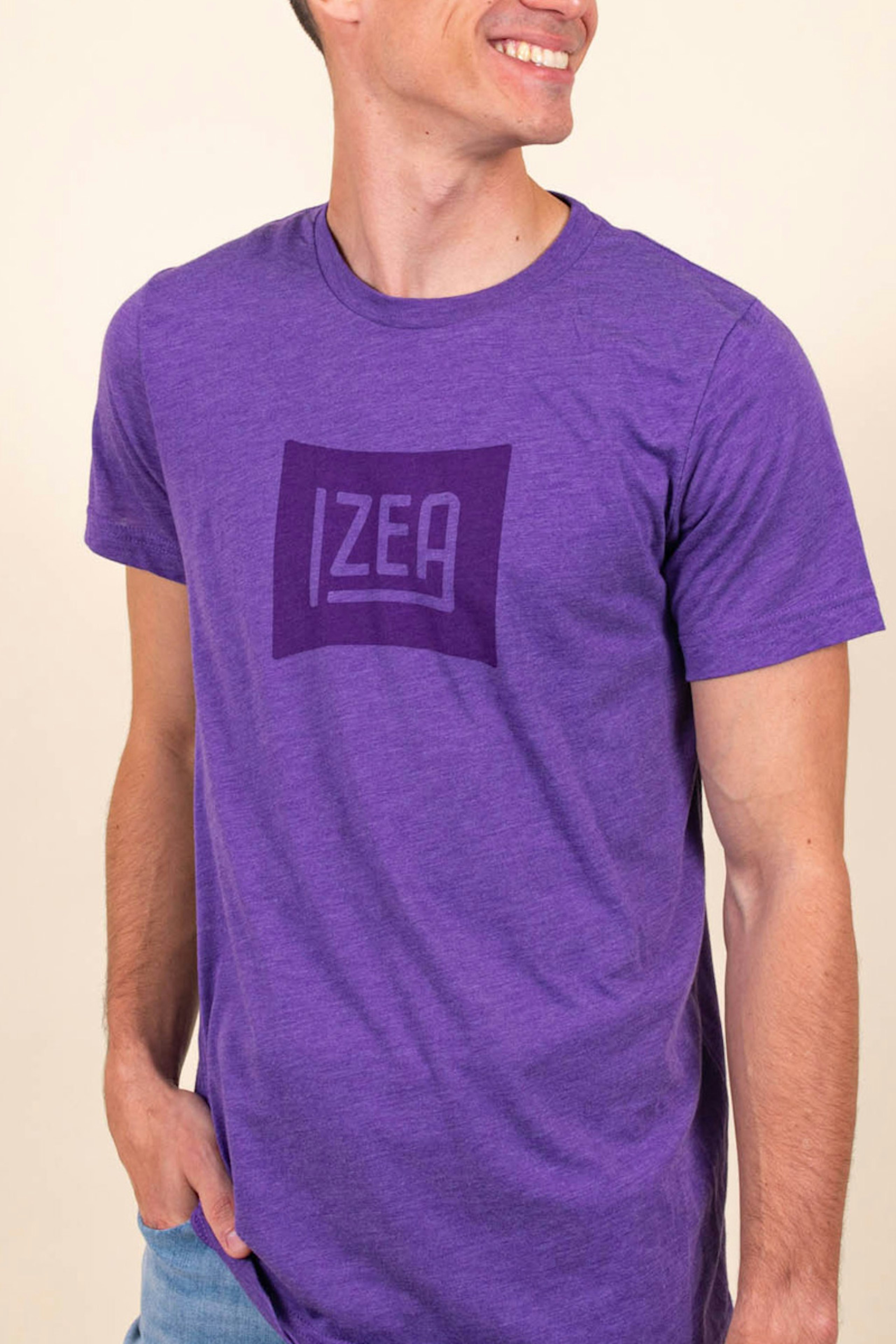 man wearing a purple t-shirt with a darker purple izea logo printed on the front