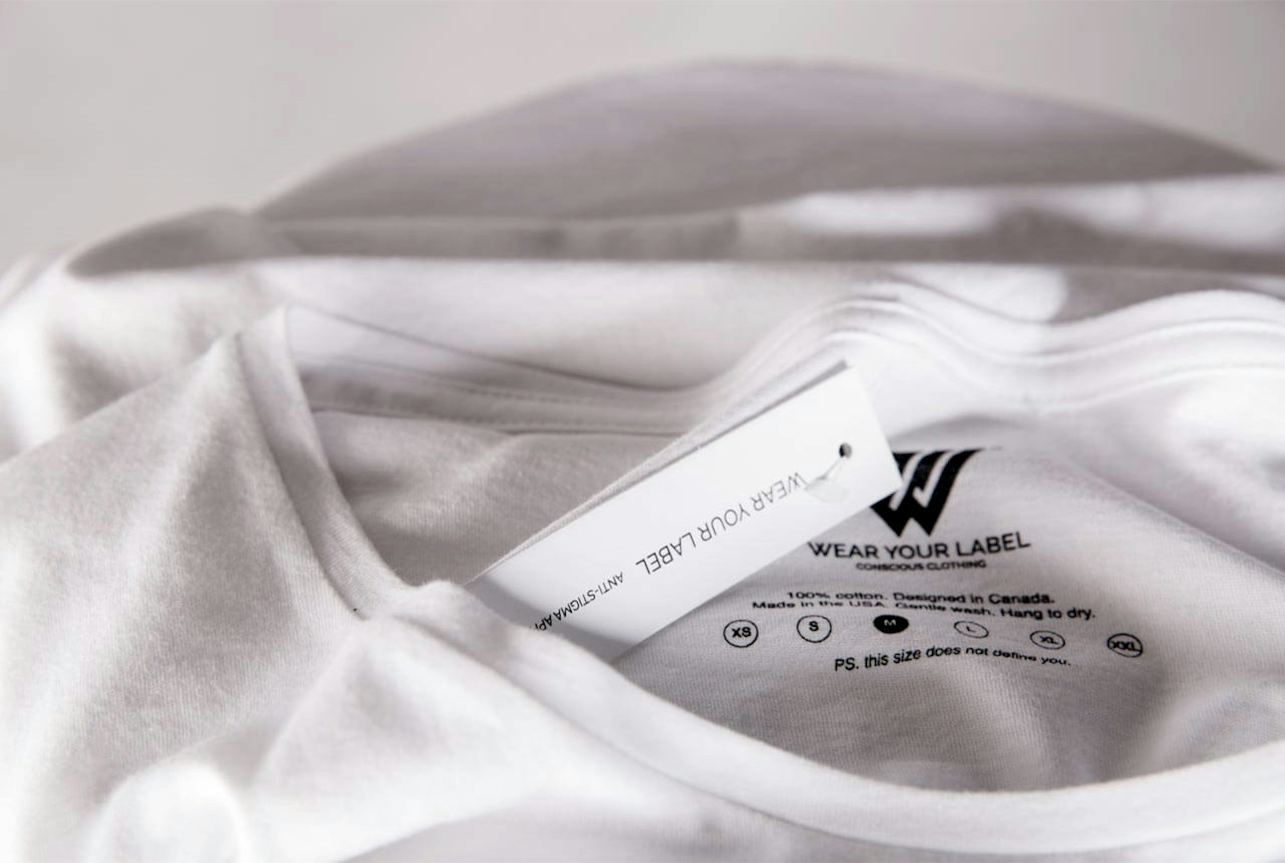 A custom hang tag and custom printed tag for Wear Your Label