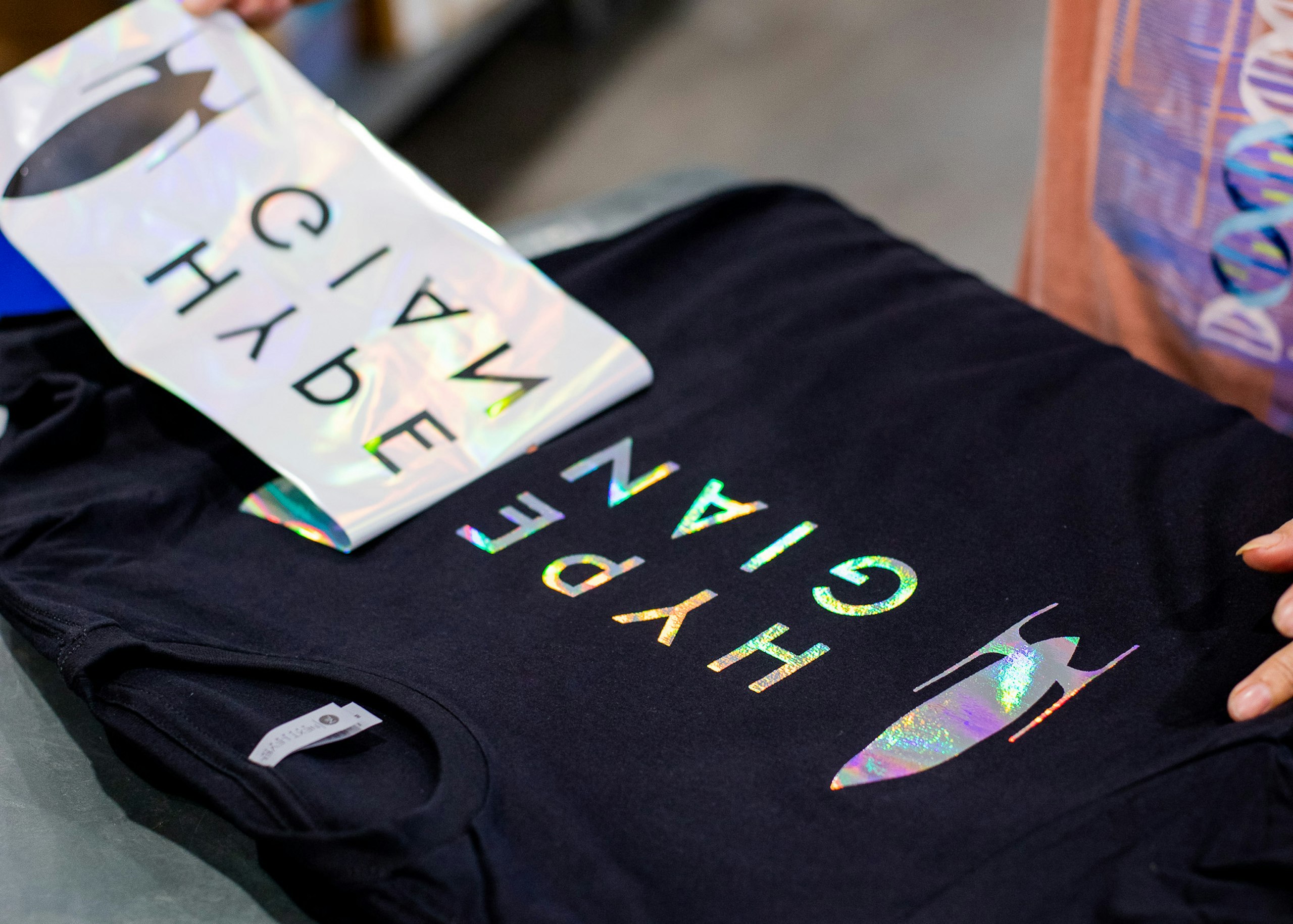 chromatic foil being added to a black t-shirt