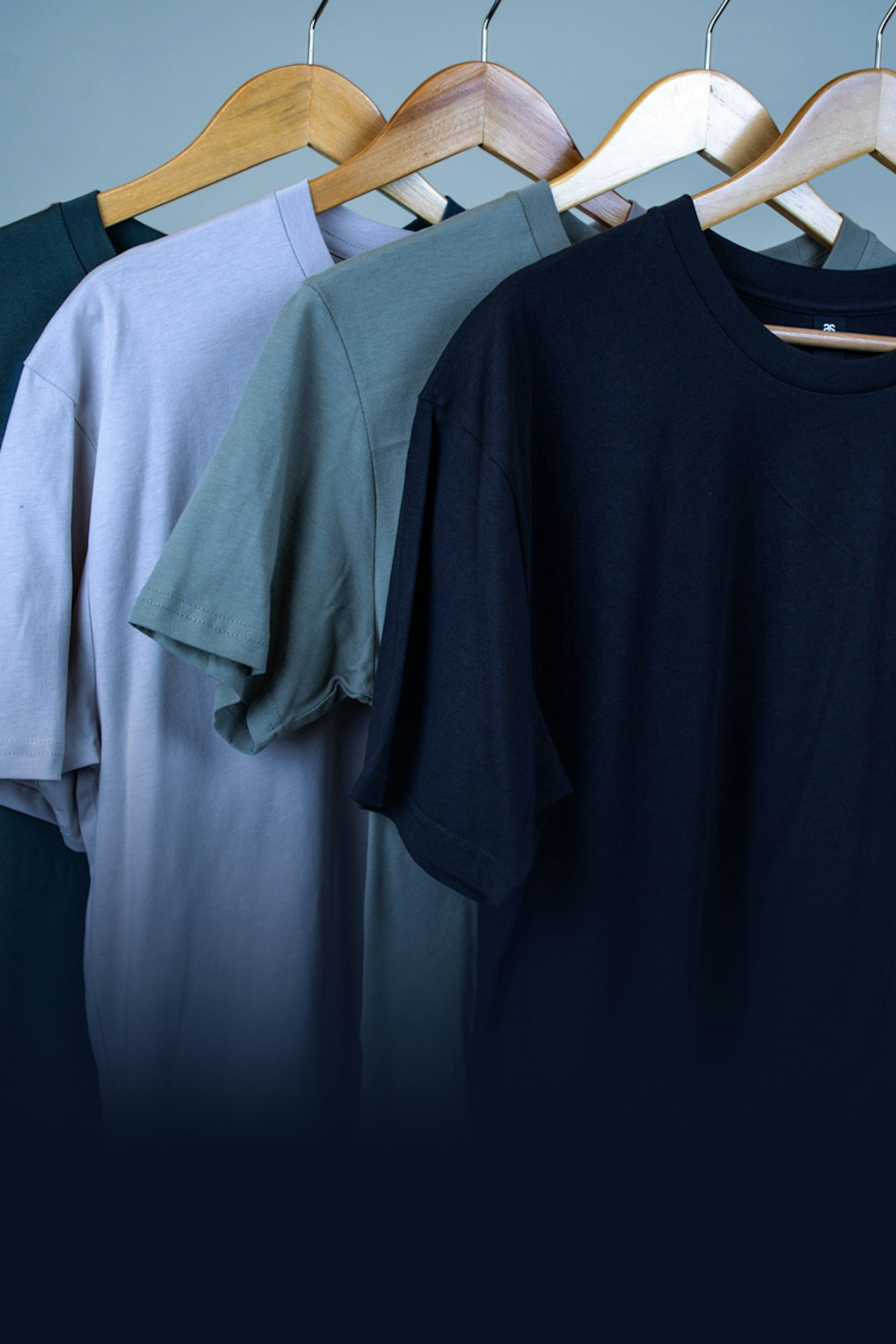 blue t-shirts hanging with the word t-shirt