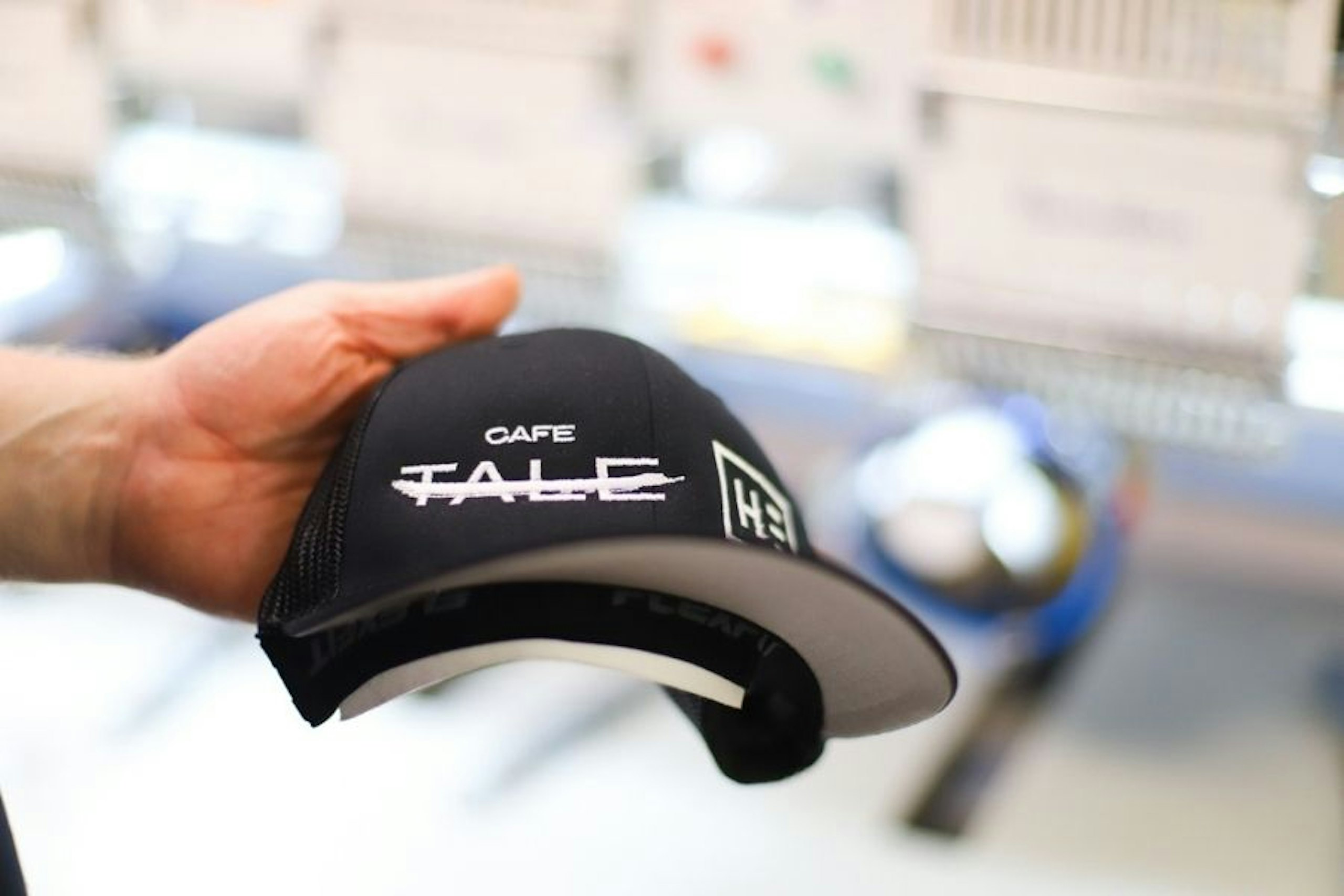 someone holding the completed hat