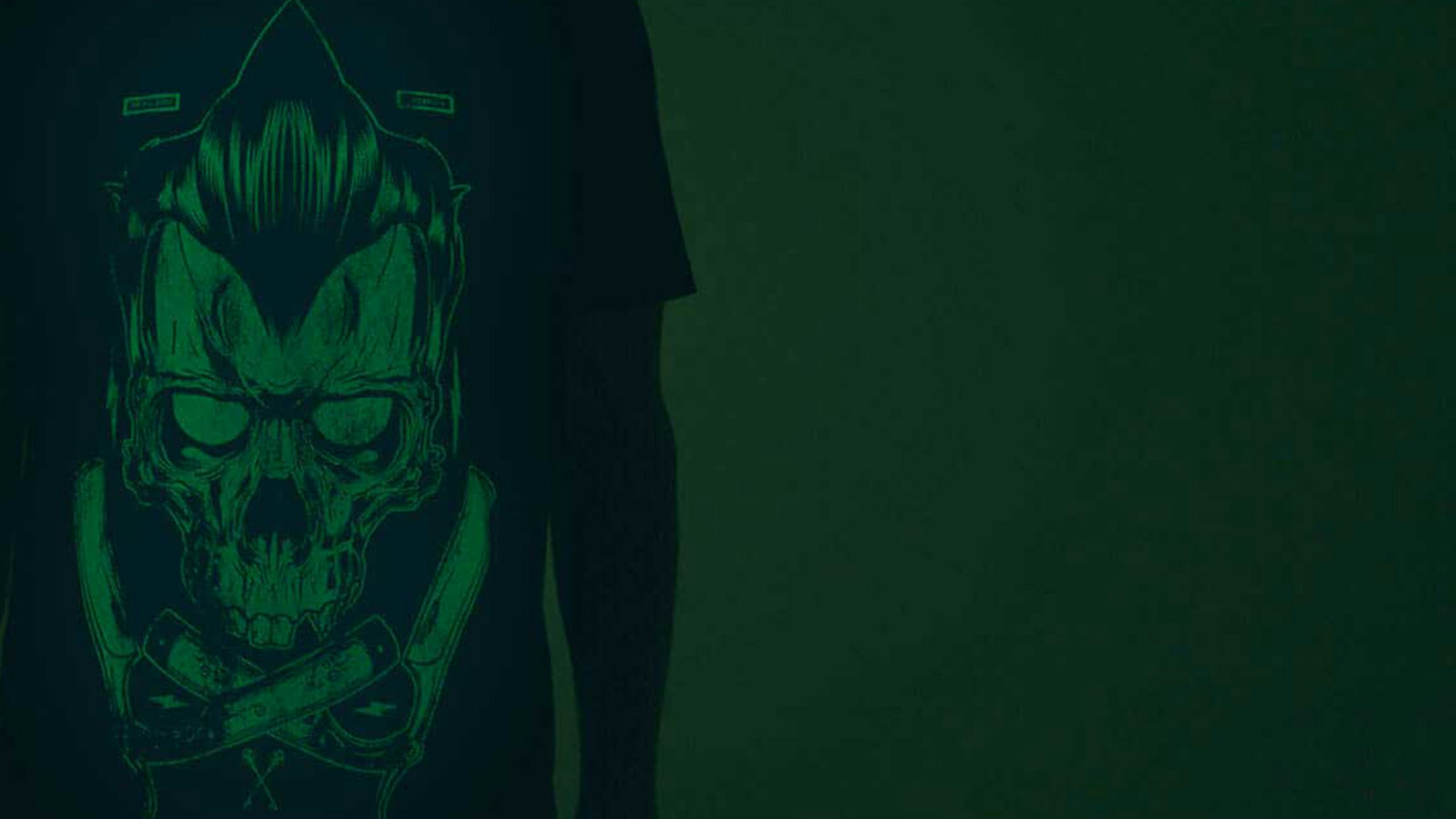 close up of a black shirt with a green glow-in-the-dark print