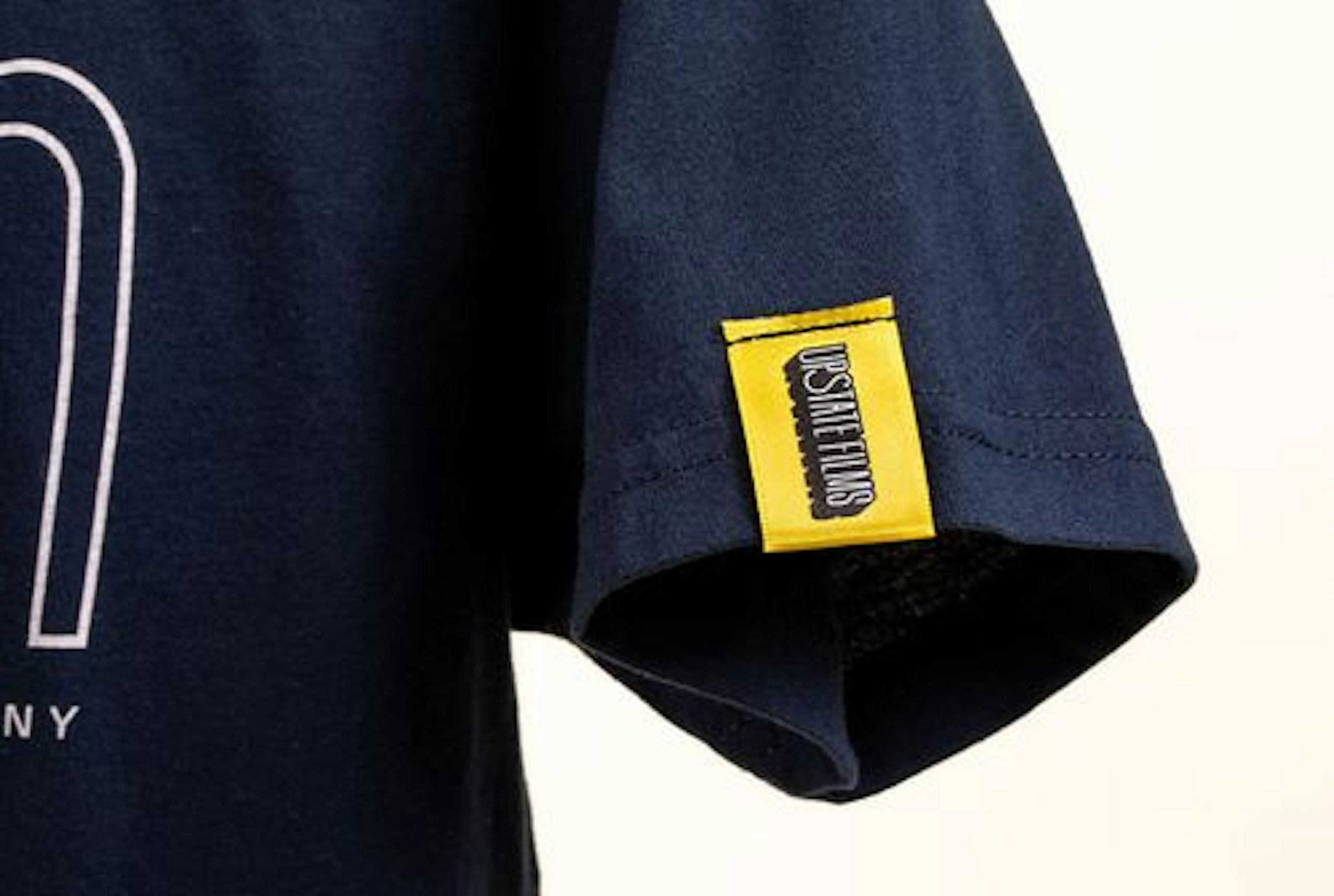 yellow hem tag on navy shirt