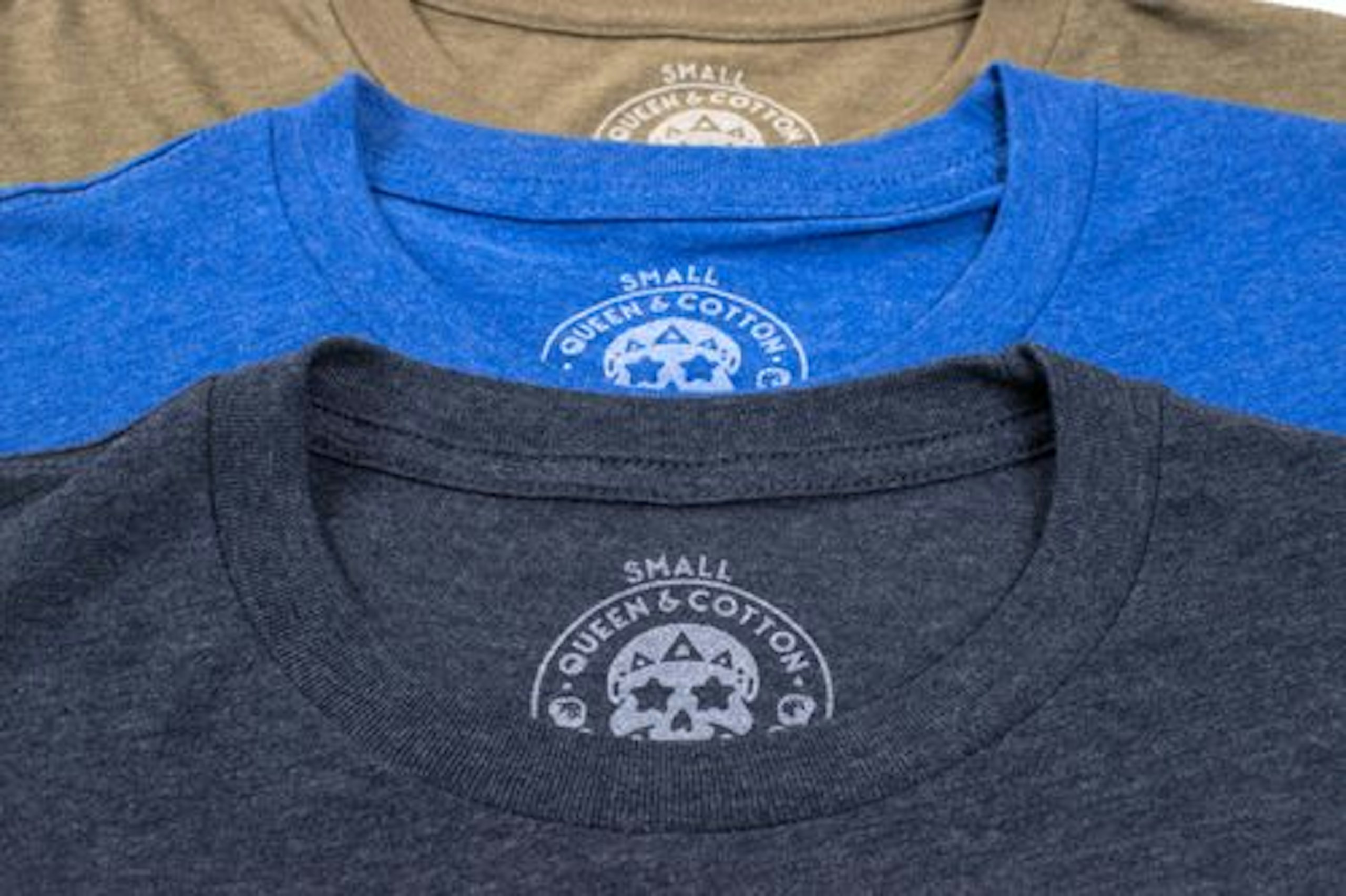 close up of three shirts with a tag printed