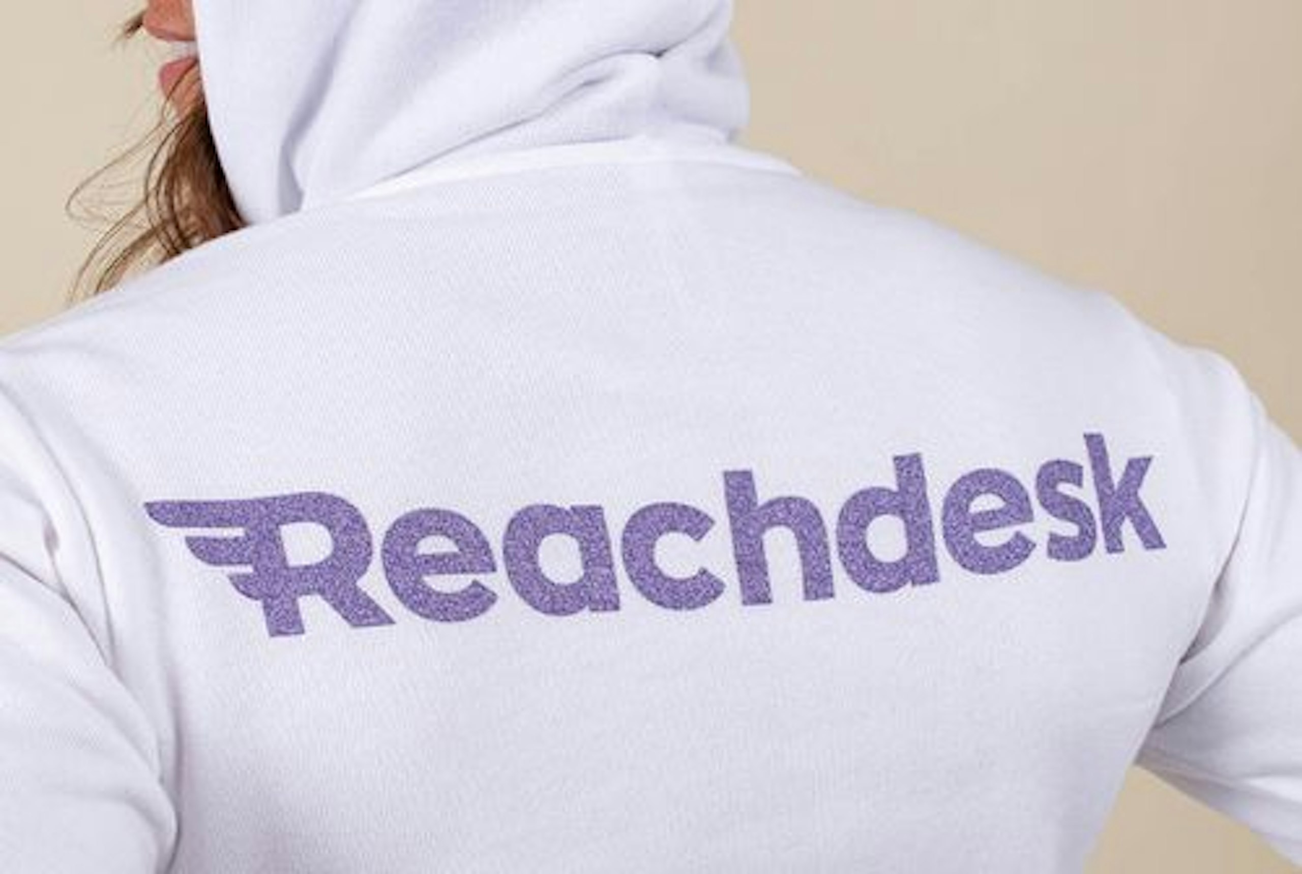 women wearing a white hoodie with metallic ink print