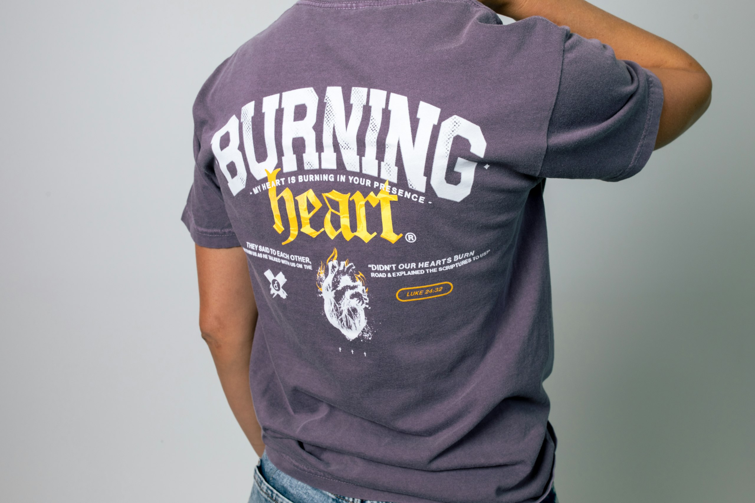 back of someone wearing a purple t-shirt