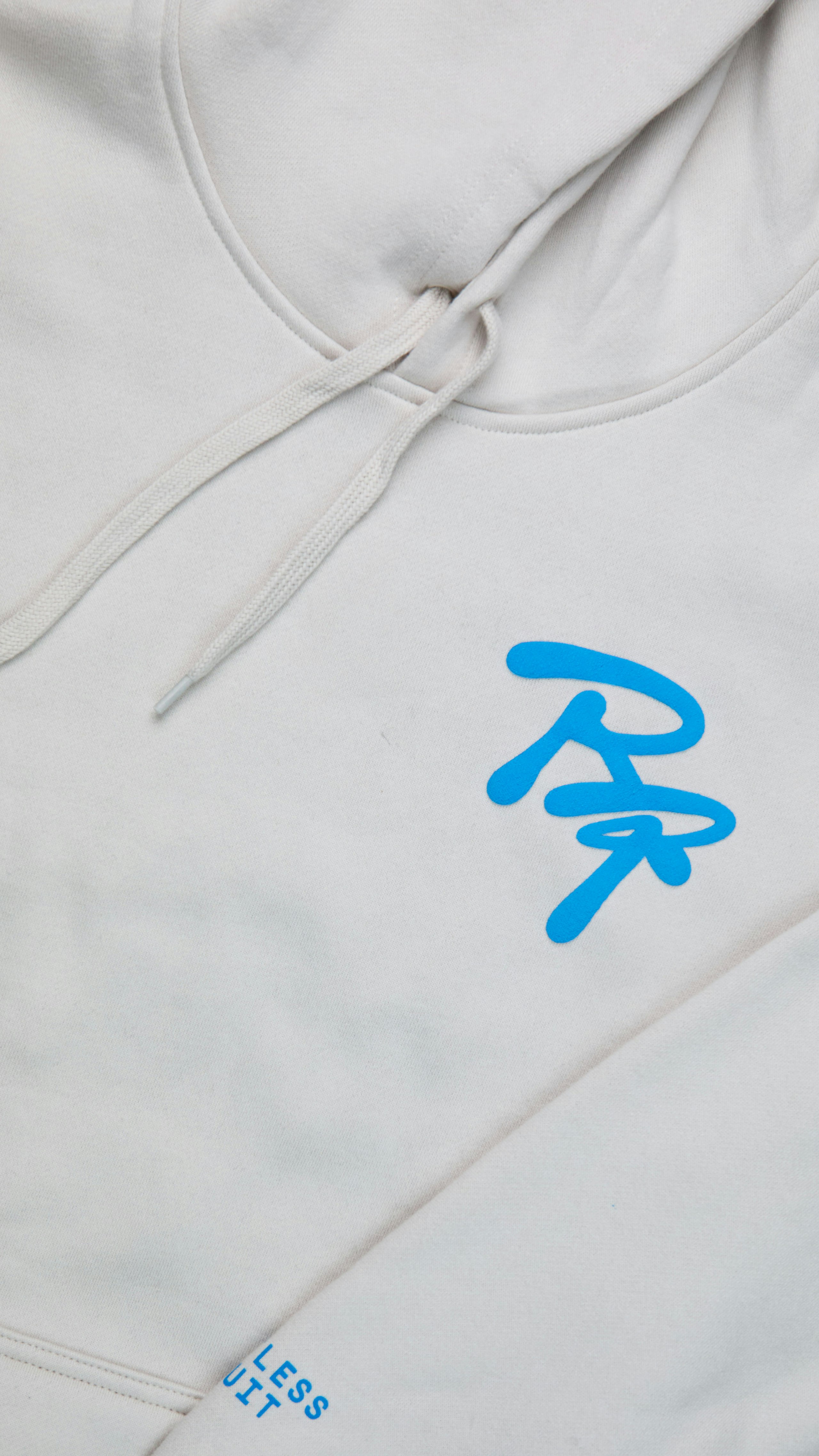 close-up of light blue puff print on a white hoodie