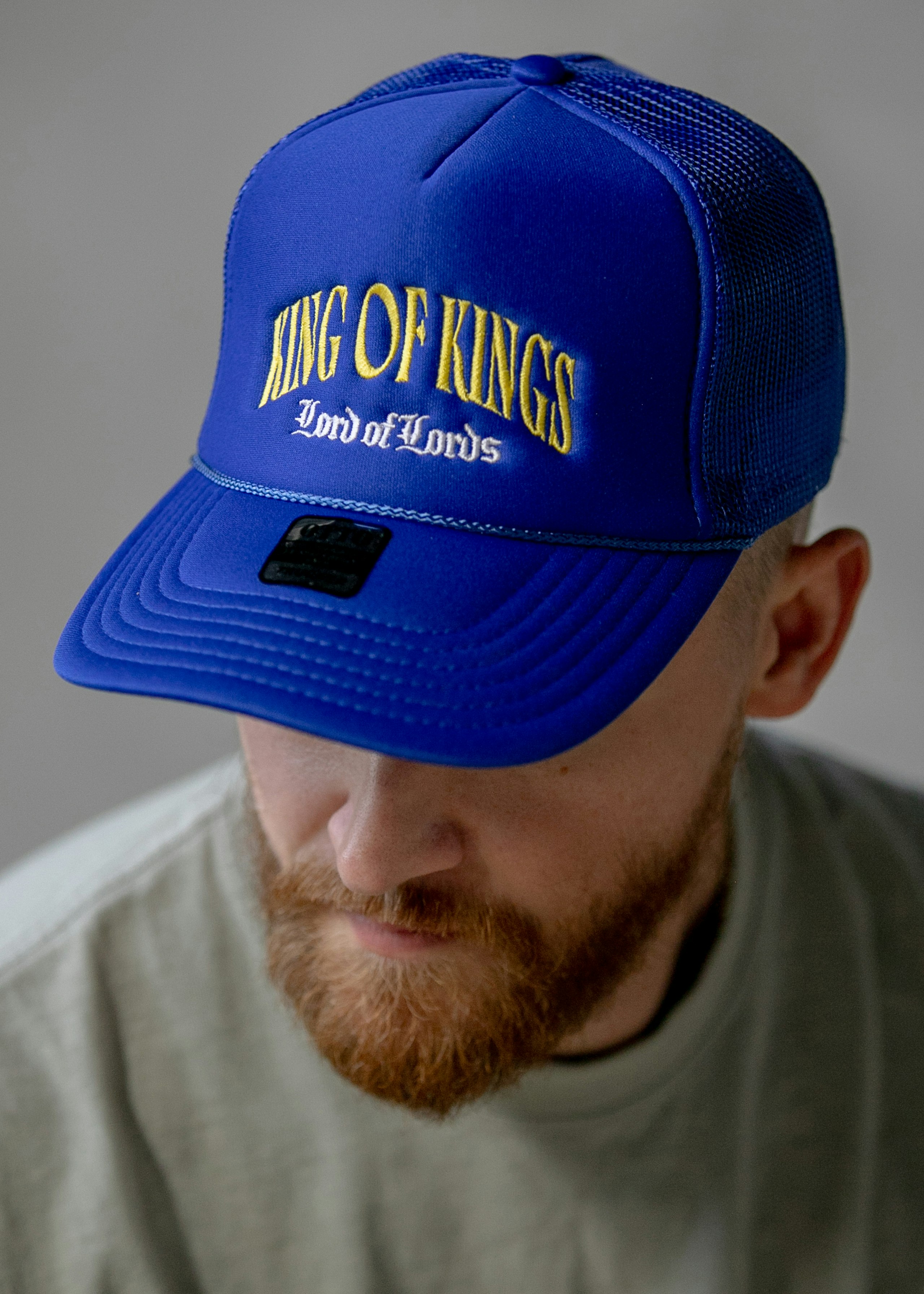man wearing a blue padded hat