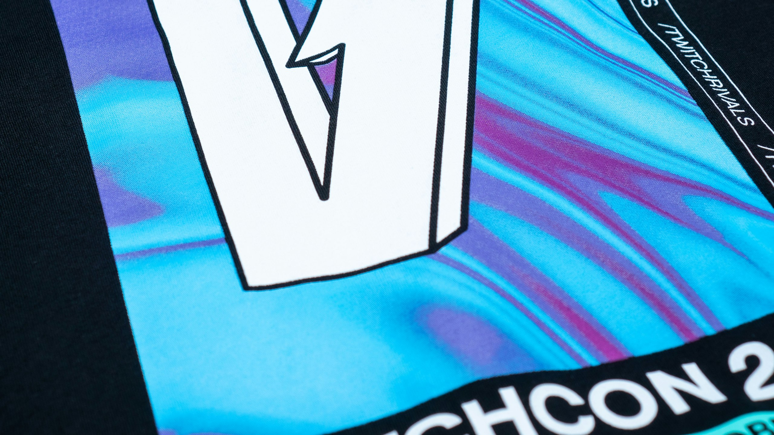 close-up on bold ink style on a black t-shirt