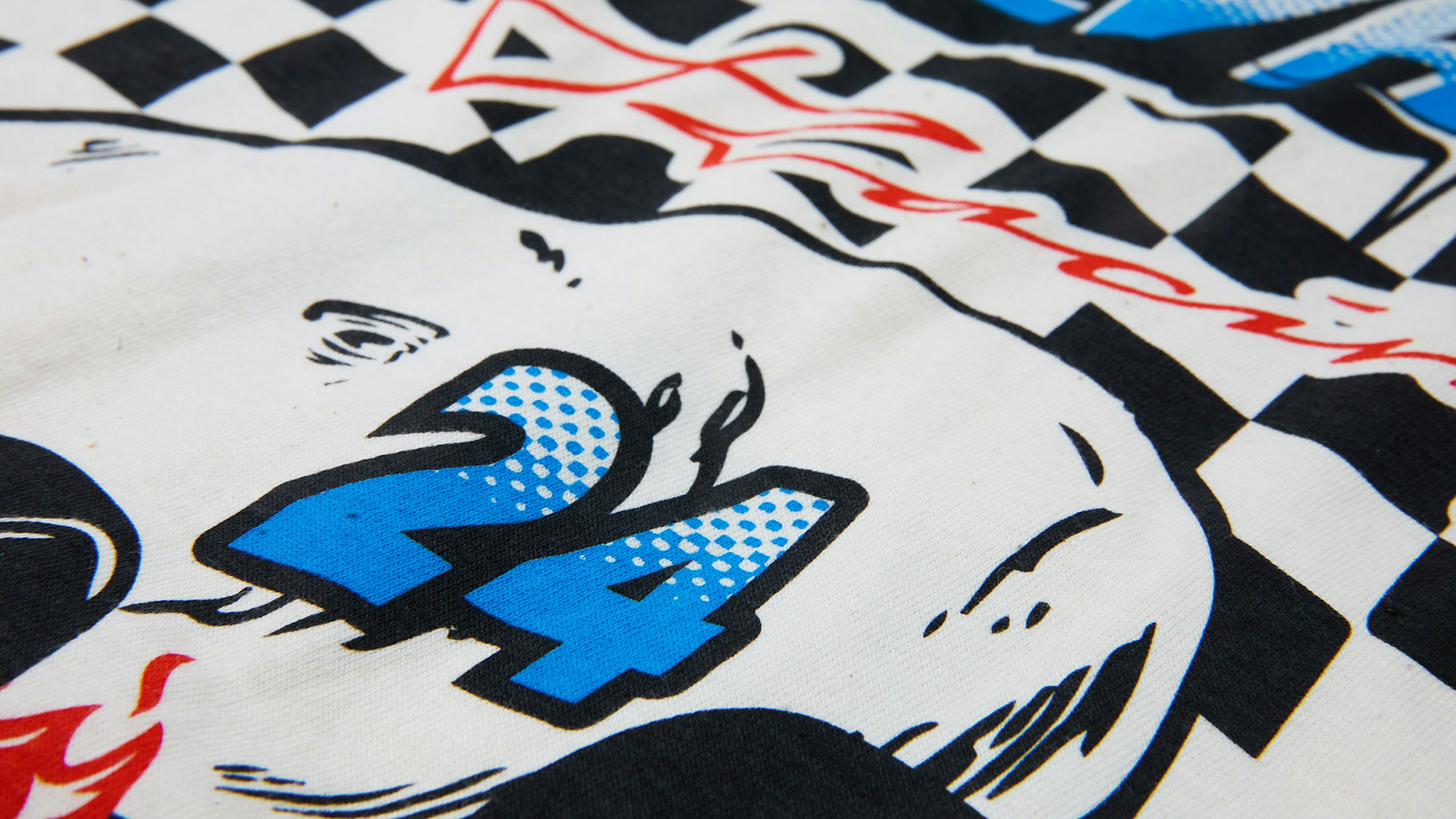 close-up of a racing tee that is printed with our super soft style