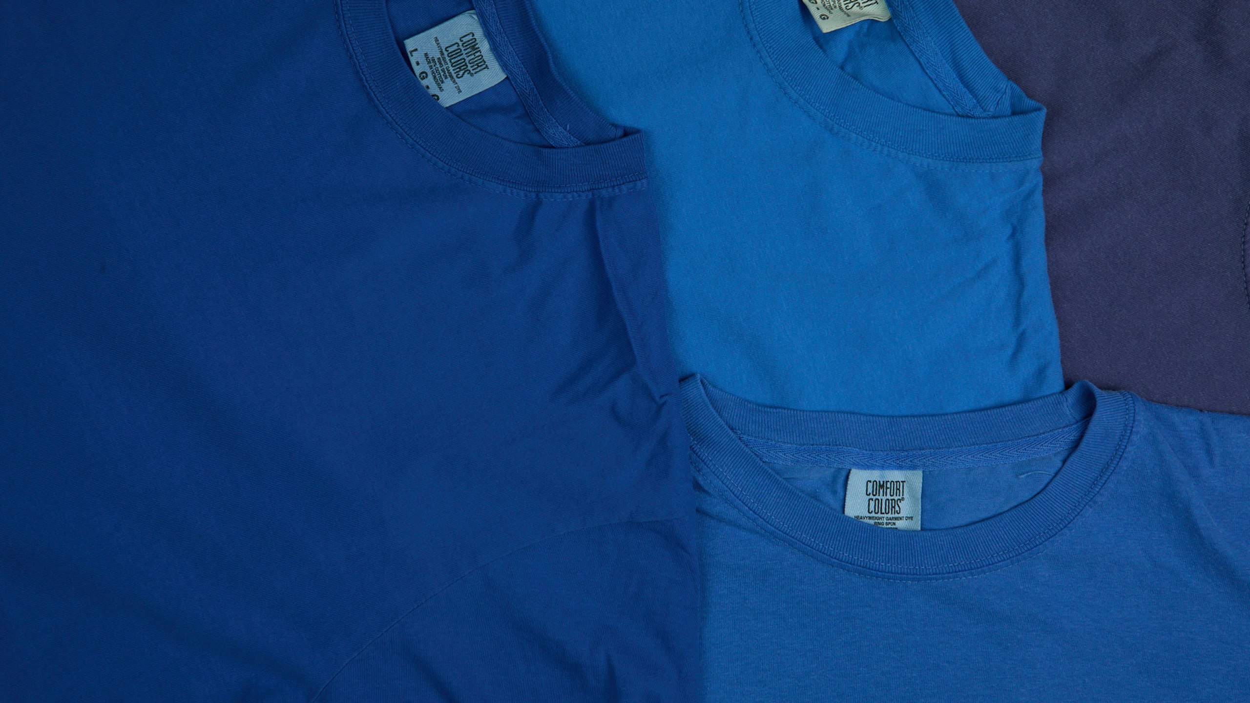 close-up of blue comfort color t-shirts