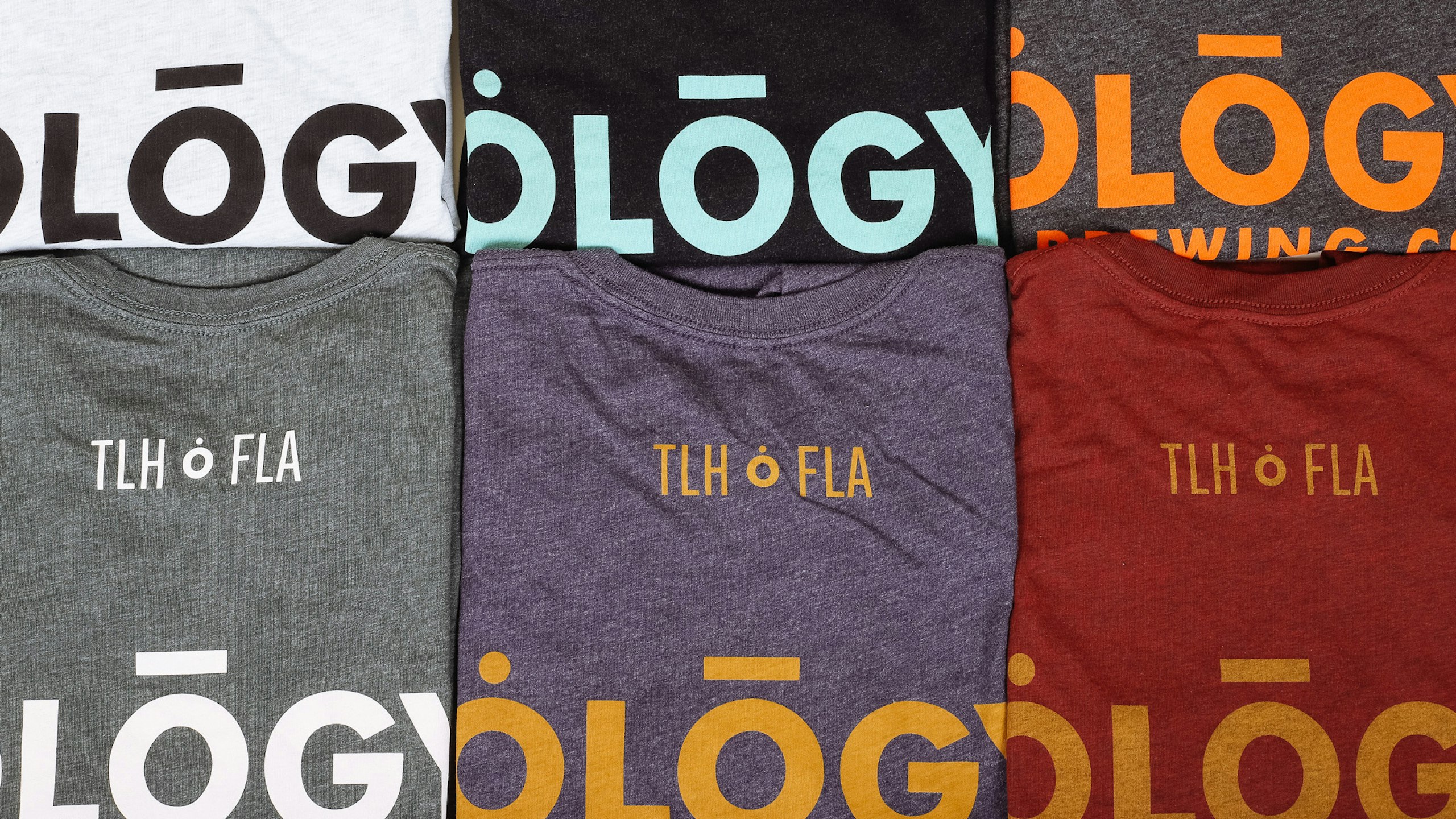 6 folded different color t-shirts