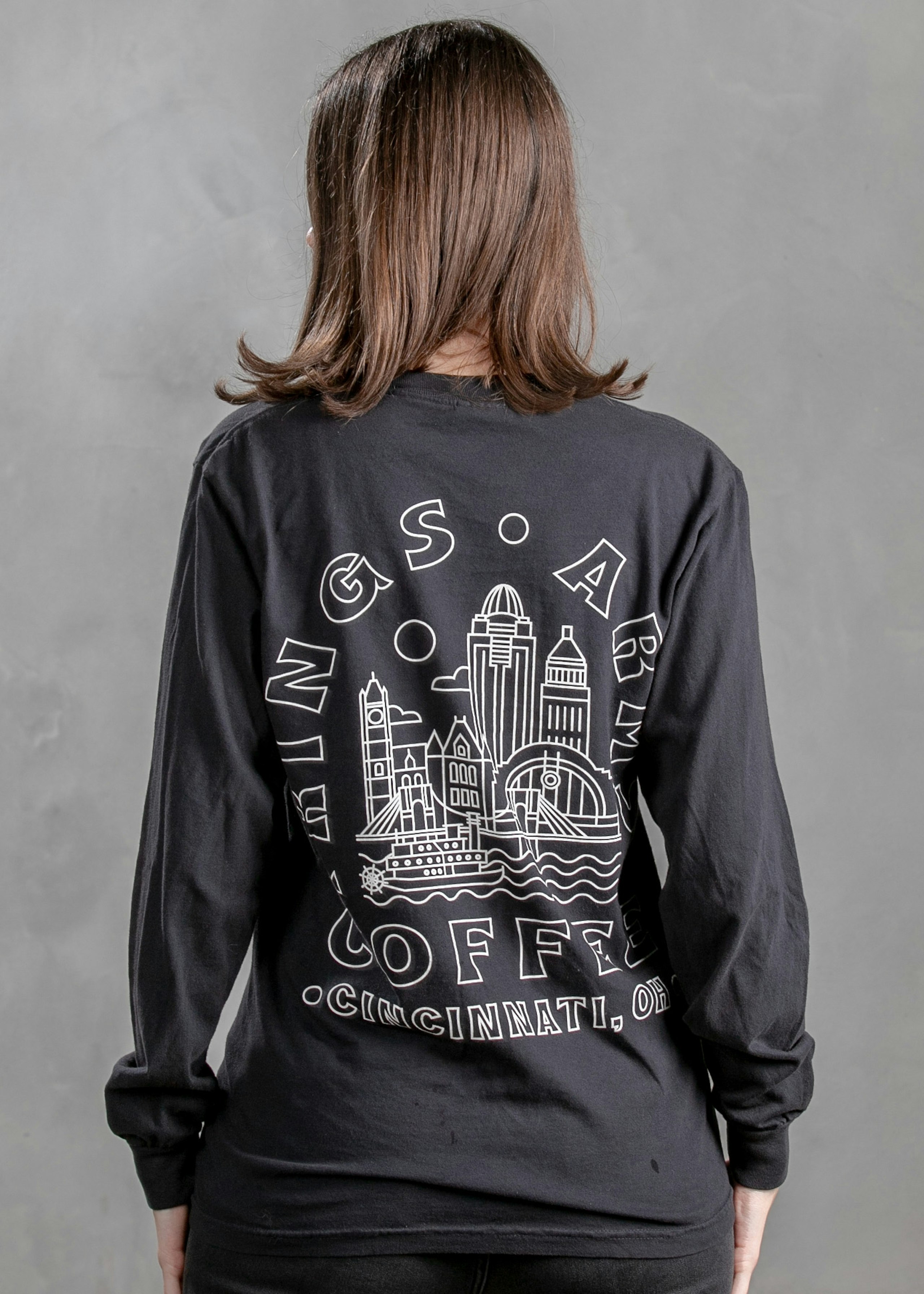 woman wearing a long sleeve black t-shirt