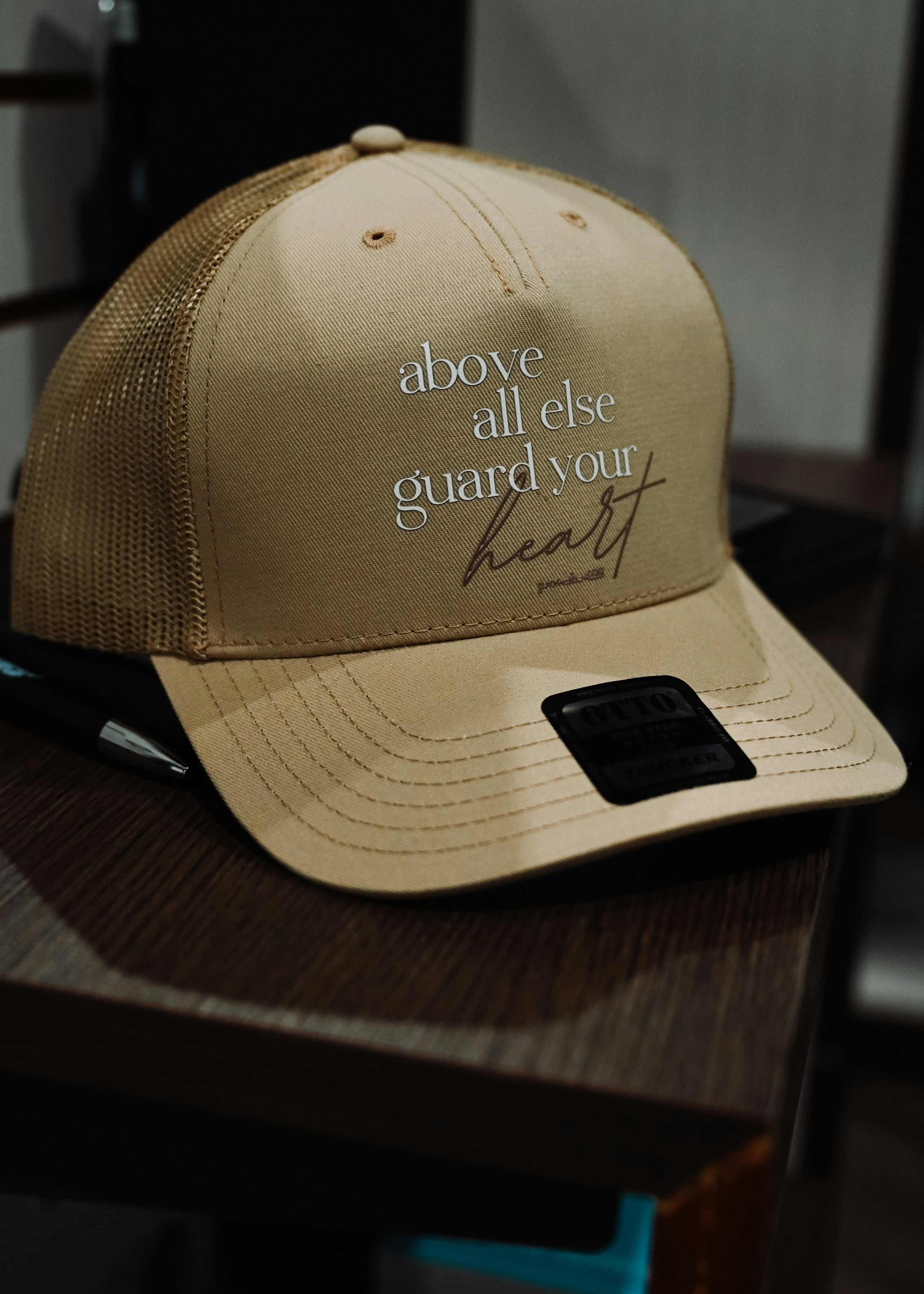 a tan hat sitting on a shelf