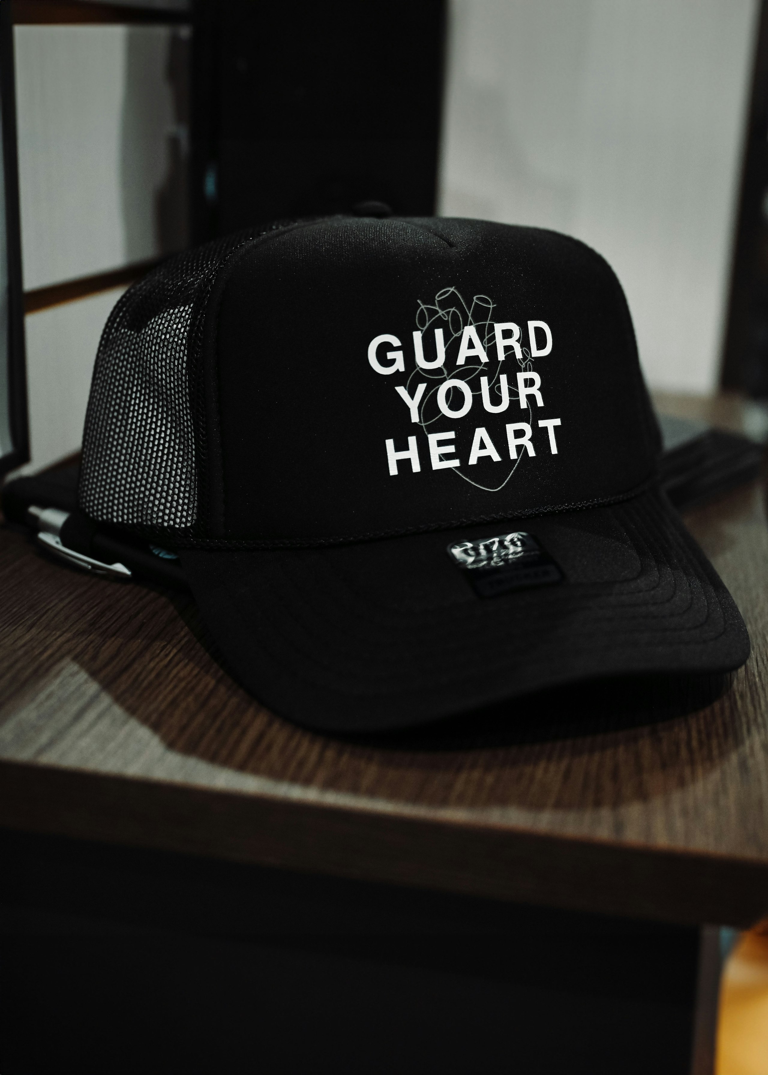 black hat sitting on a shelf